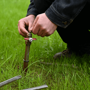 Sprinkler repair technician at work